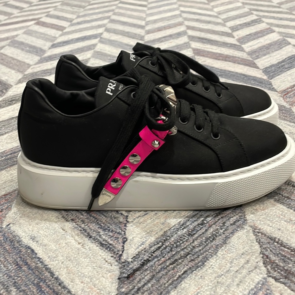 PRADA
Studded strap sneakers black with hot pink buckle strap